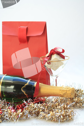 Image of Christmas gifts and champagne