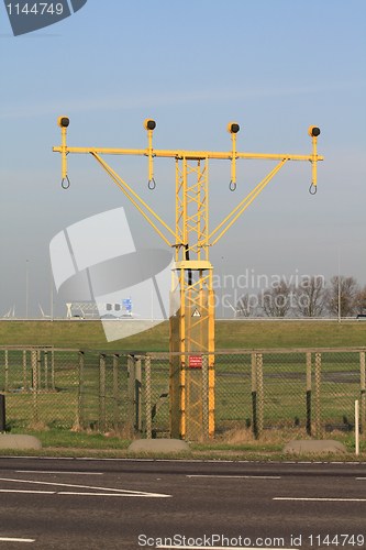 Image of Traffic lights near an airport runway