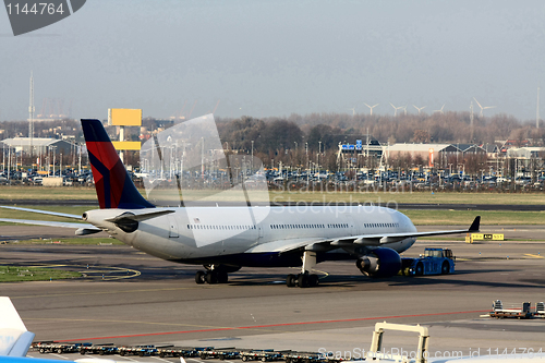 Image of plane pulled back to the runway