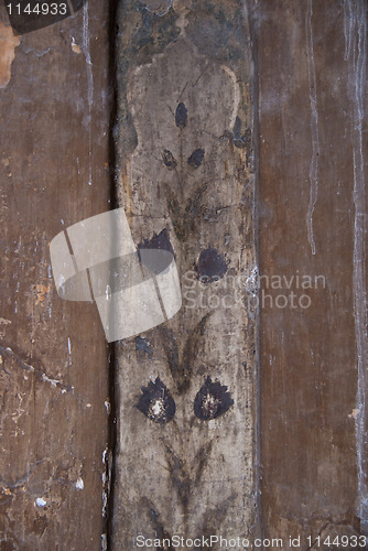 Image of Fading colors of painting on the palace wall.