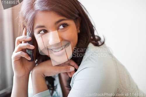 Image of Asian student on the phone