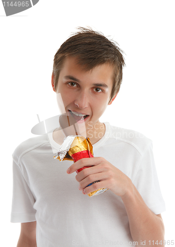 Image of Boy eating chocolate bunny