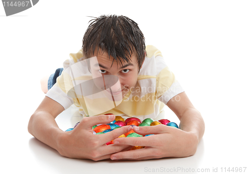Image of Boy hoarding easter eggs