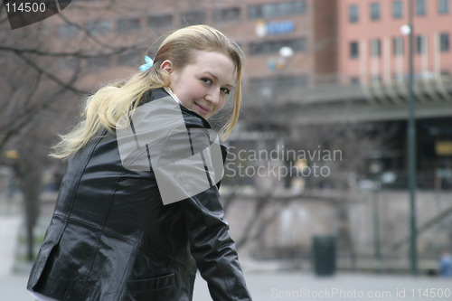 Image of Woman Sitting in City