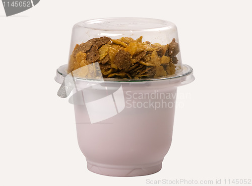 Image of yogurt with corn flakes in a plastic container