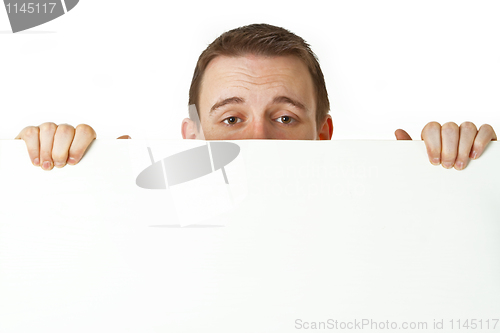 Image of Young businessman with white board