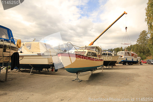Image of Small boats on marina.