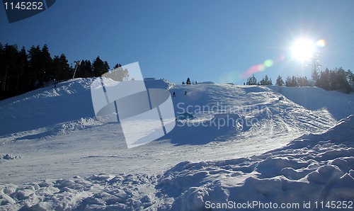 Image of People on ski in the hill.