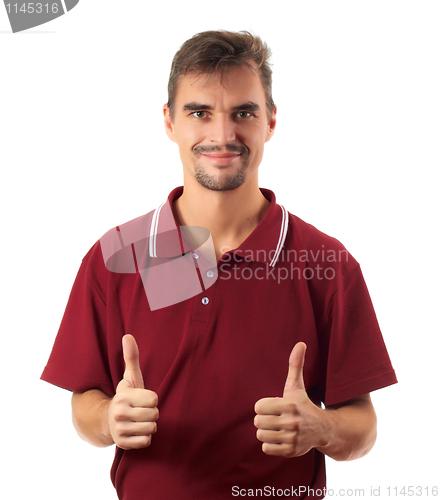 Image of young man thumb up and smiling isolated on white