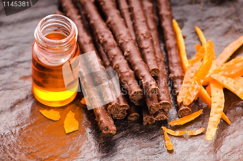Image of chocolate sticks with orange