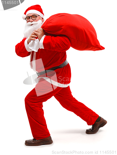 Image of Santa claus walking with full bag