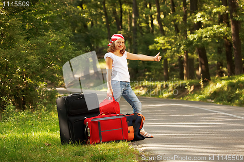 Image of Young hitch-hiker girl