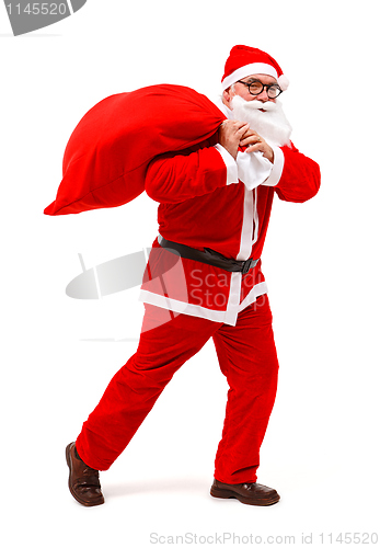 Image of Santa claus walking with full bag