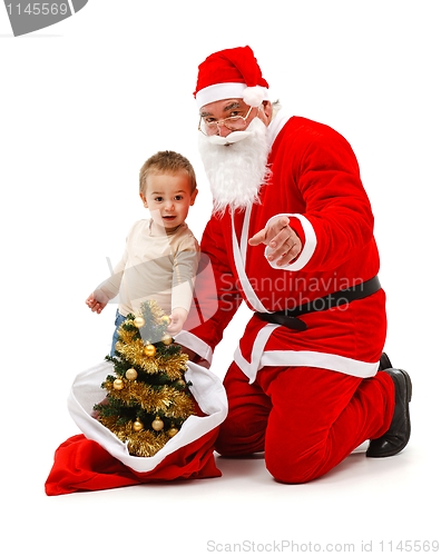 Image of Santa claus and little boy looking at us