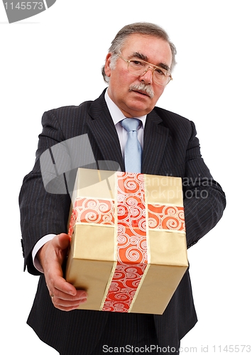 Image of Senior man offering gift