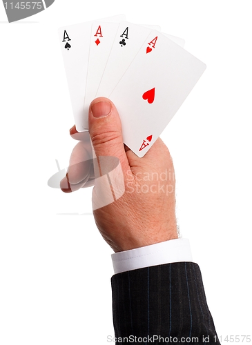 Image of Man's hand holding aces