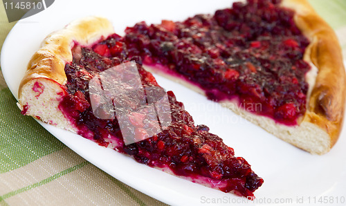 Image of Two pieces of apple and cowberry jelly pie 