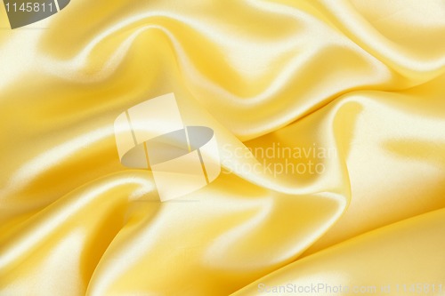 Image of Smooth elegant golden silk as background 