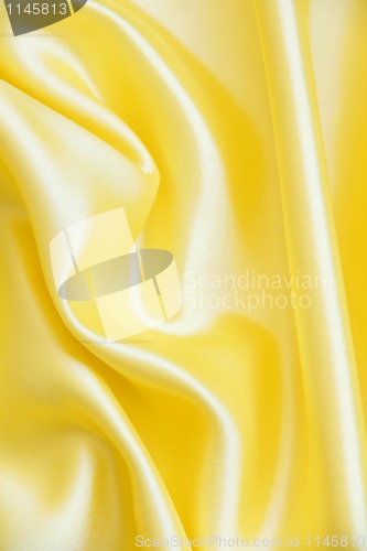 Image of Smooth elegant golden silk as background 