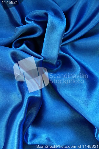 Image of Smooth elegant blue silk as background 