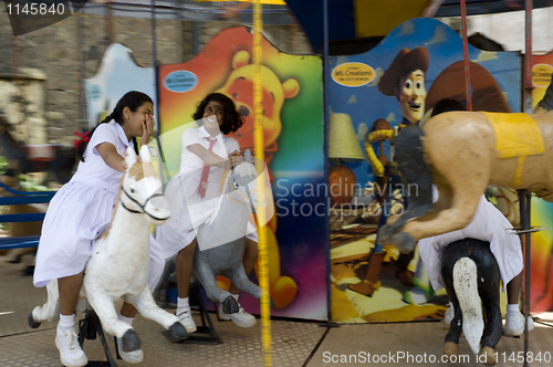 Image of Girls on carusel