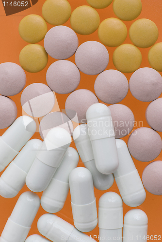 Image of White, pink and orange pills