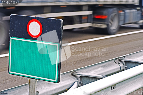 Image of Blanc road sign at highway with truck 