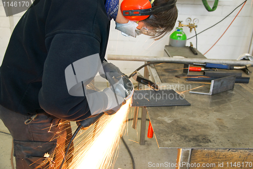 Image of metal worker grinder