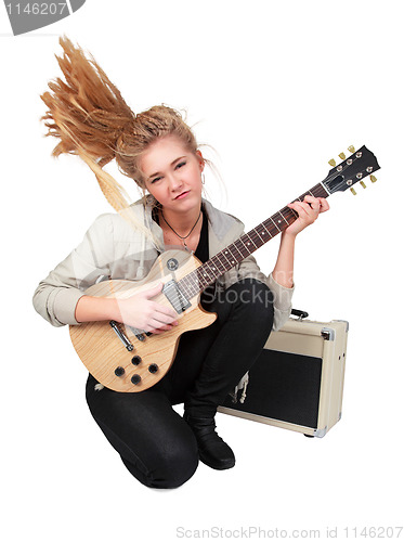 Image of Passionate rock Girl Playing An Electric Guitar