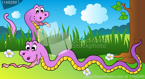 Image of Two cartoon snakes on meadow