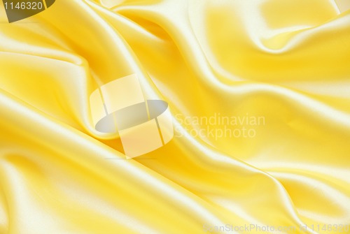 Image of Smooth elegant golden silk as background 