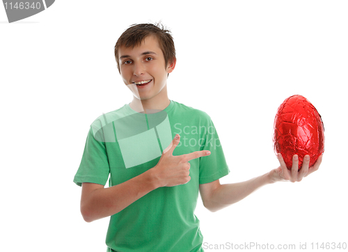 Image of Boy pointing to an easter egg