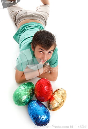 Image of Boy with four large easter eggs