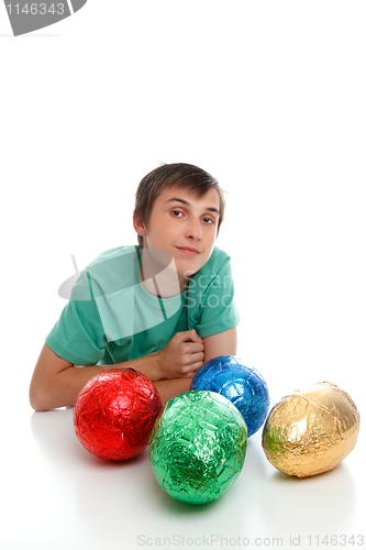 Image of Boy with chocolate easter eggs