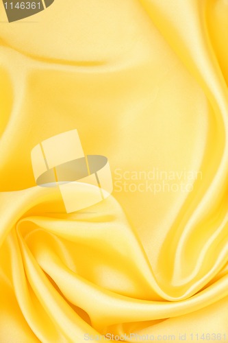 Image of Smooth elegant golden silk as background 