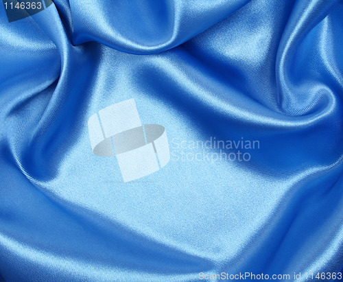 Image of Smooth elegant blue silk as background 