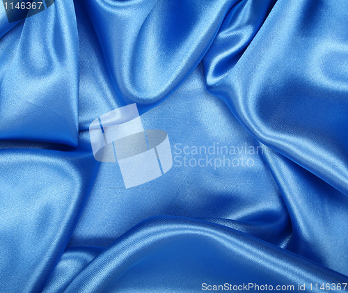 Image of Smooth elegant blue silk as background 