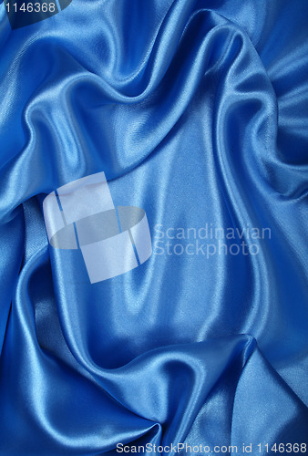 Image of Smooth elegant blue silk as background 