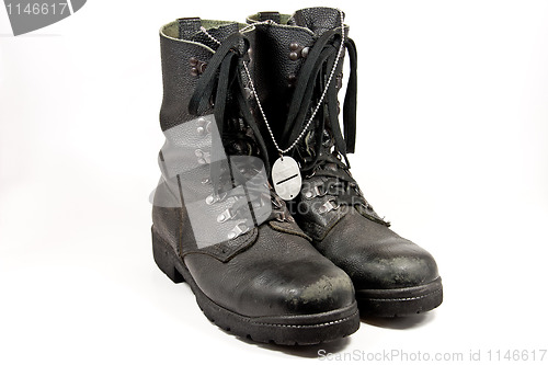 Image of Army boots with dog-tag