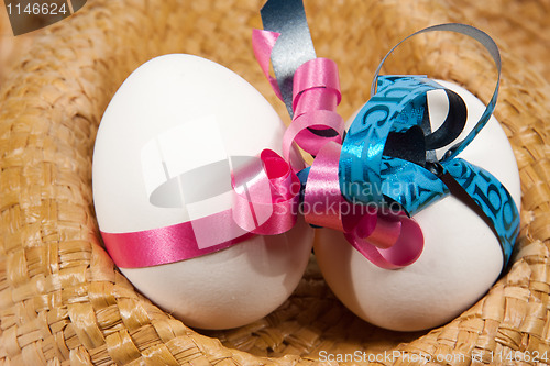 Image of Boy and girl egg in a hat