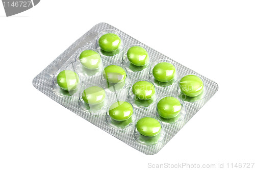 Image of Package of green pills isolated on white 