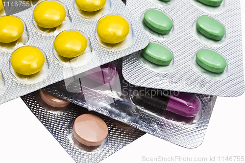 Image of Colorful pills closeup on white background 