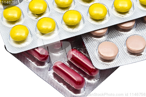 Image of Colorful pills closeup on white background 