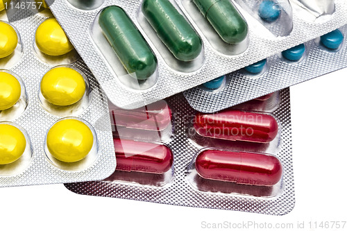 Image of Colorful pills closeup on white background 