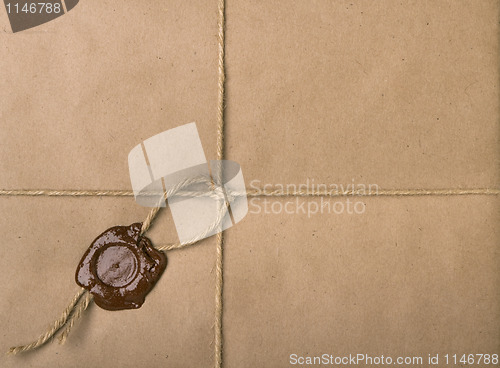 Image of parcel with a rope and wax