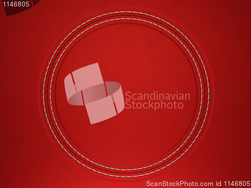 Image of Red stitched circle shape on leather background