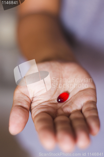 Image of pill on hand