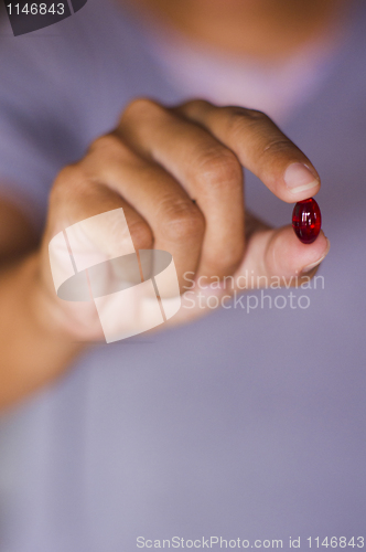 Image of pill on hand