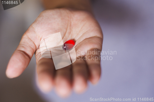 Image of pill on hand