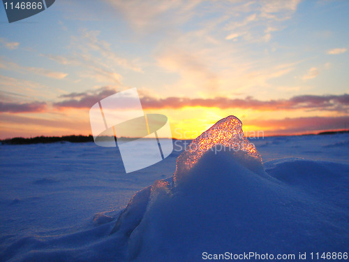 Image of Winter frosen sea sunset and gold ice in Finland